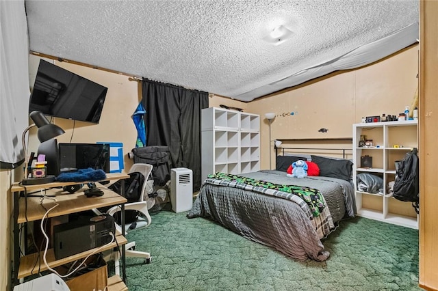 bedroom with a textured ceiling and carpet flooring