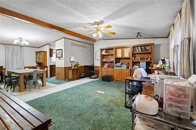 interior space featuring ceiling fan with notable chandelier, a textured ceiling, lofted ceiling with beams, and wooden walls