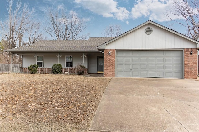 ranch-style house featuring a garage and covered porch