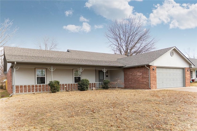 ranch-style home featuring covered porch and a garage