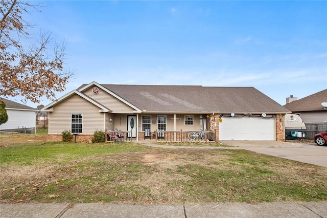 ranch-style home with a front lawn, covered porch, and a garage