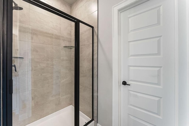 bathroom featuring an enclosed shower