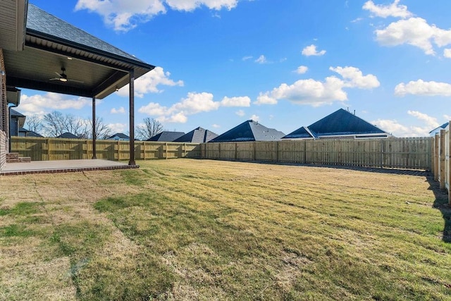 view of yard featuring ceiling fan