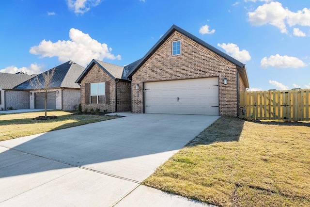 view of front property featuring a garage and a front yard