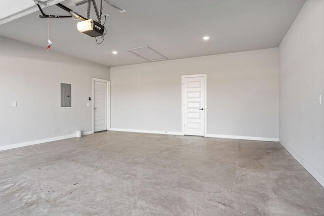 garage with a garage door opener and electric panel