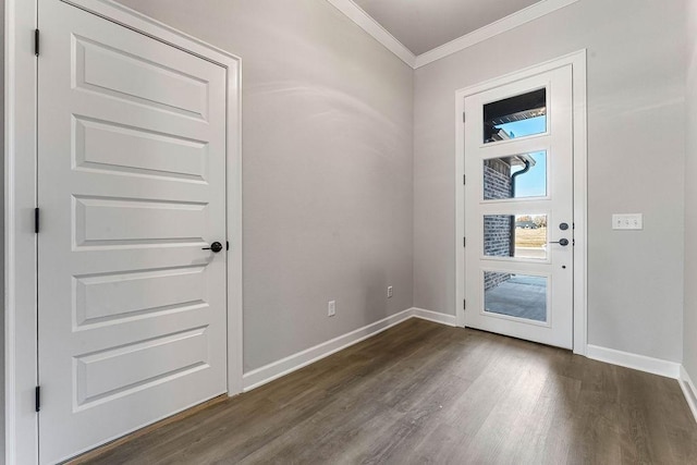 foyer featuring dark wood-type flooring and ornamental molding