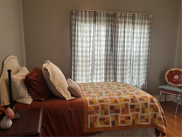 bedroom with hardwood / wood-style flooring