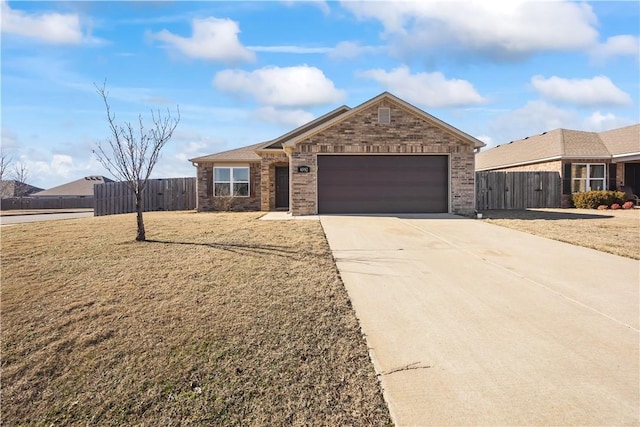 ranch-style house with a garage and a front yard