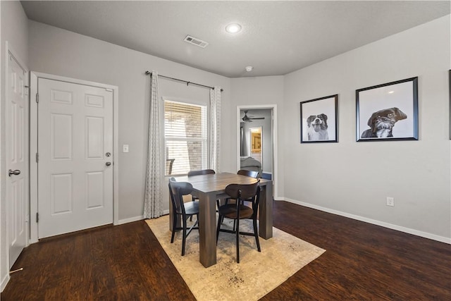 dining room featuring ceiling fan and dark hardwood / wood-style flooring