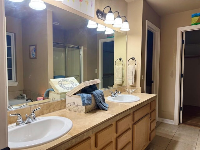 bathroom with tile patterned flooring, separate shower and tub, and vanity