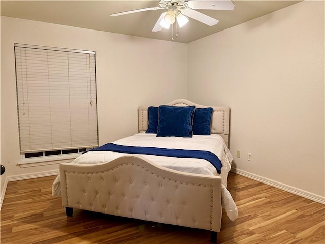 bedroom featuring ceiling fan and hardwood / wood-style floors