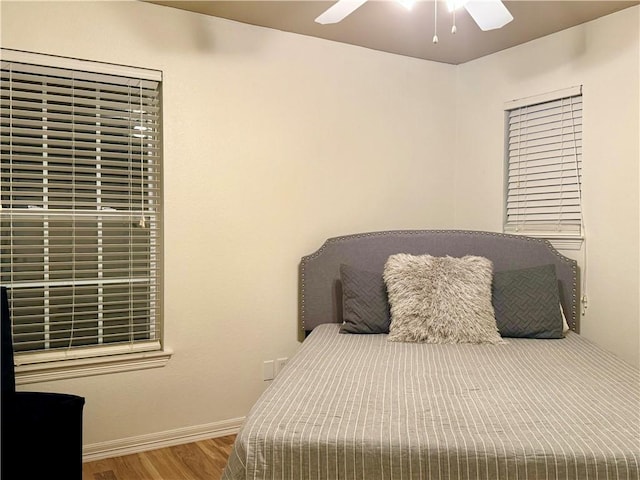 bedroom featuring ceiling fan and hardwood / wood-style flooring