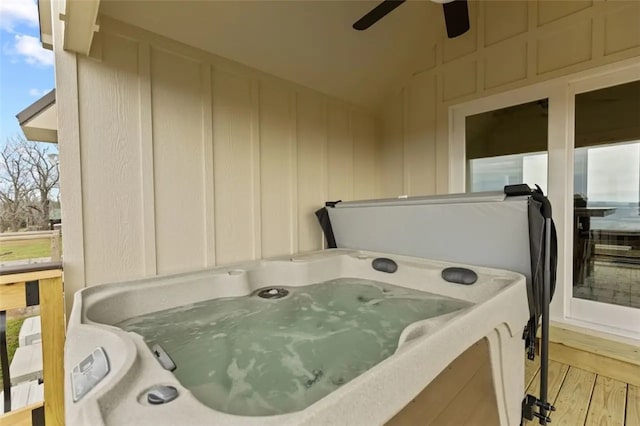 exterior space featuring a jacuzzi and light hardwood / wood-style flooring