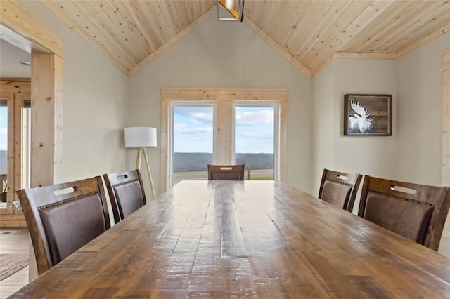 dining area featuring wooden ceiling, lofted ceiling, and wood-type flooring