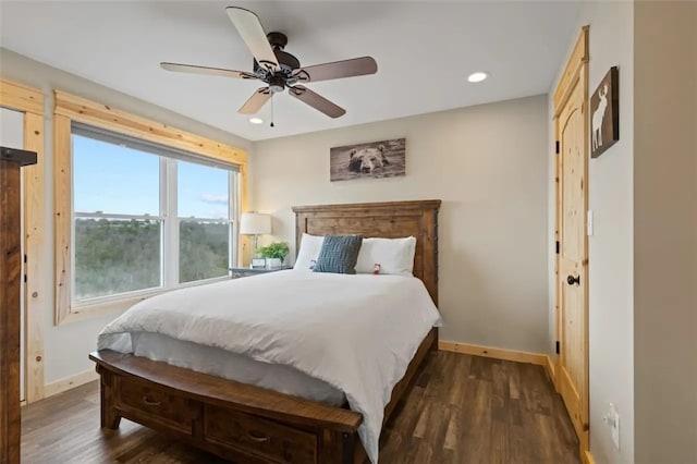 bedroom featuring ceiling fan and dark hardwood / wood-style floors