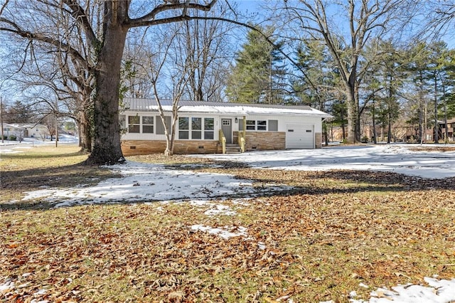 ranch-style home featuring a garage