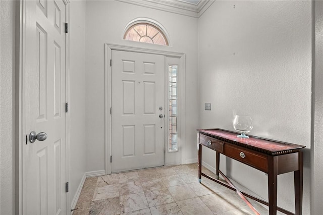 foyer featuring ornamental molding