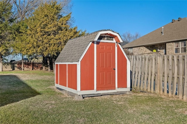 view of outbuilding with a lawn