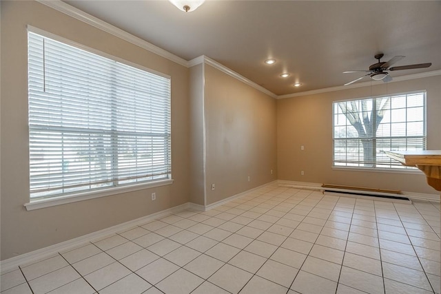 spare room featuring ceiling fan, a baseboard heating unit, light tile patterned floors, and ornamental molding