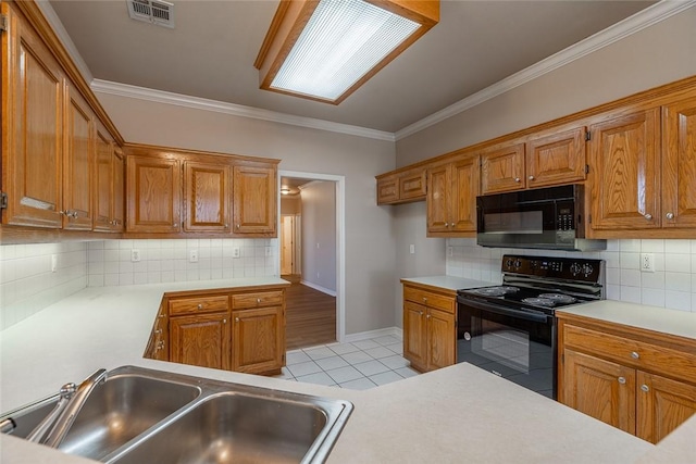 kitchen with backsplash, black appliances, sink, ornamental molding, and light tile patterned floors