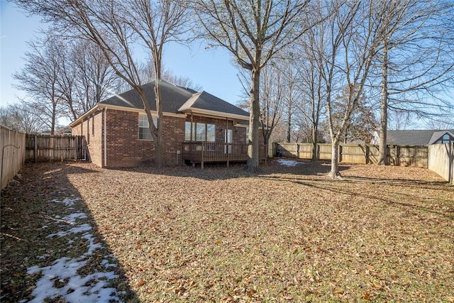 back of property featuring a wooden deck