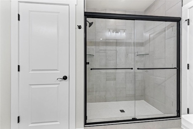 bathroom with a shower stall