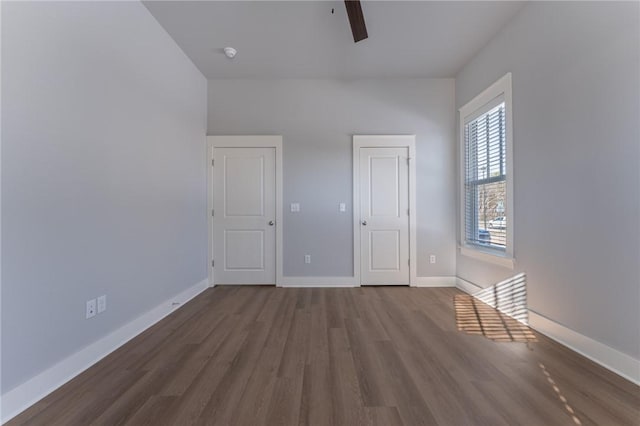 unfurnished bedroom with ceiling fan and hardwood / wood-style floors