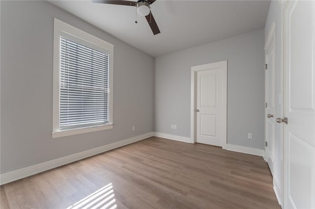 unfurnished bedroom featuring ceiling fan and light hardwood / wood-style floors