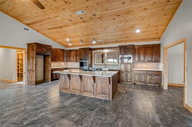 kitchen with a center island, decorative backsplash, appliances with stainless steel finishes, wood ceiling, and high vaulted ceiling