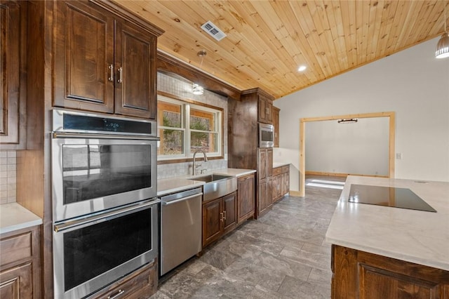 kitchen with decorative light fixtures, decorative backsplash, sink, appliances with stainless steel finishes, and wooden ceiling