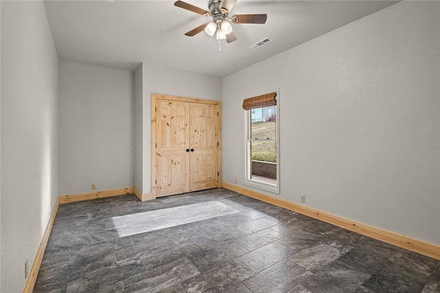 unfurnished bedroom featuring ceiling fan