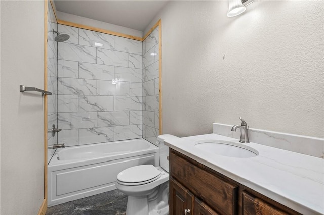 full bathroom with toilet, tiled shower / bath, and vanity