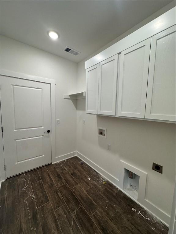 laundry room featuring cabinets, hookup for a washing machine, and electric dryer hookup