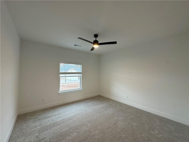 carpeted empty room with ceiling fan