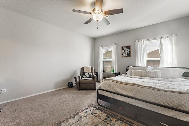 bedroom featuring ceiling fan and carpet