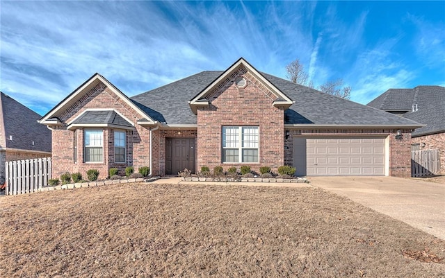 view of front of home with a garage and a front lawn