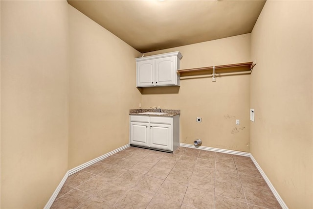 clothes washing area with cabinets, sink, and electric dryer hookup