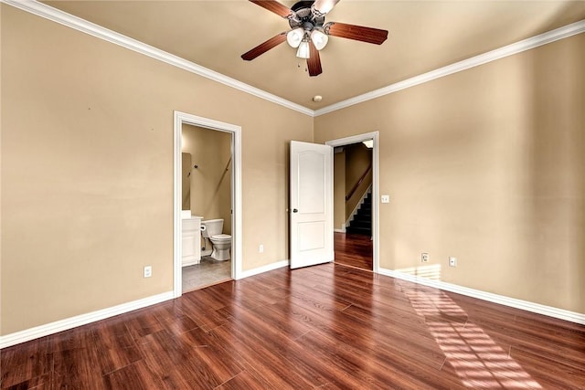 unfurnished bedroom featuring ceiling fan, crown molding, connected bathroom, and dark hardwood / wood-style floors