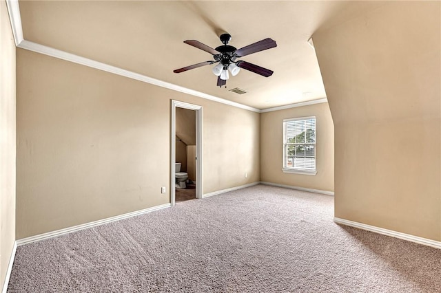 carpeted spare room featuring ceiling fan and crown molding