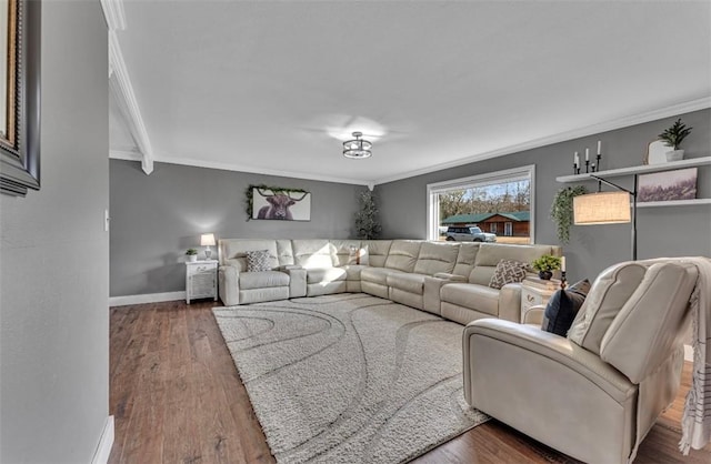 living room with dark wood-type flooring and ornamental molding