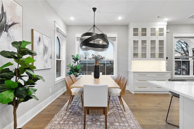 dining space with light hardwood / wood-style flooring