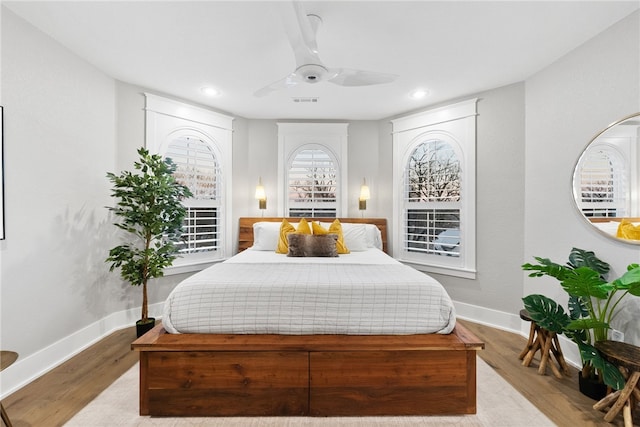 bedroom featuring ceiling fan and light wood-type flooring