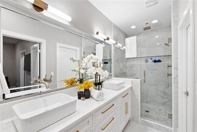 bathroom with vanity and walk in shower