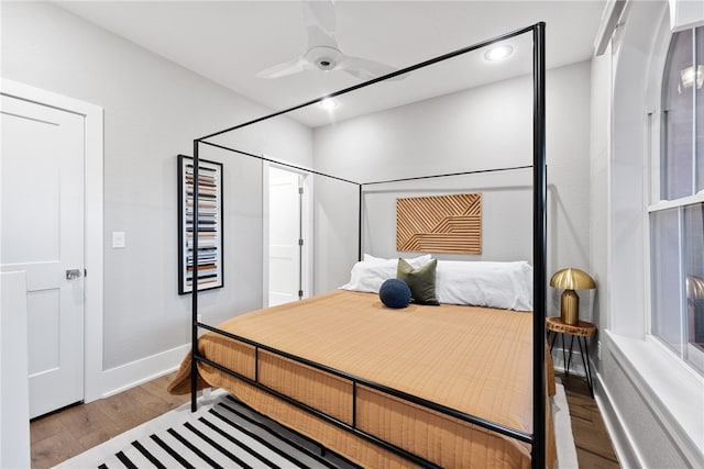 bedroom with light wood-type flooring and ceiling fan