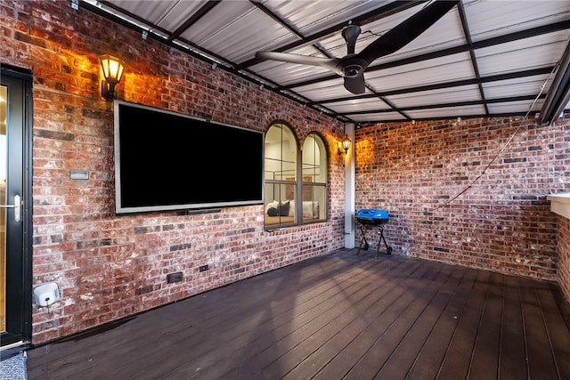 wooden terrace featuring ceiling fan and a grill