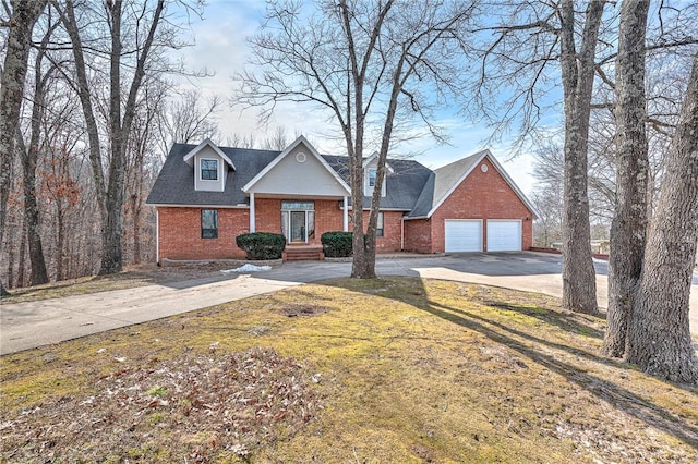 view of front of home with a front lawn and a garage