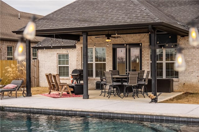 back of house featuring ceiling fan and a patio area