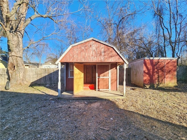 view of shed with fence