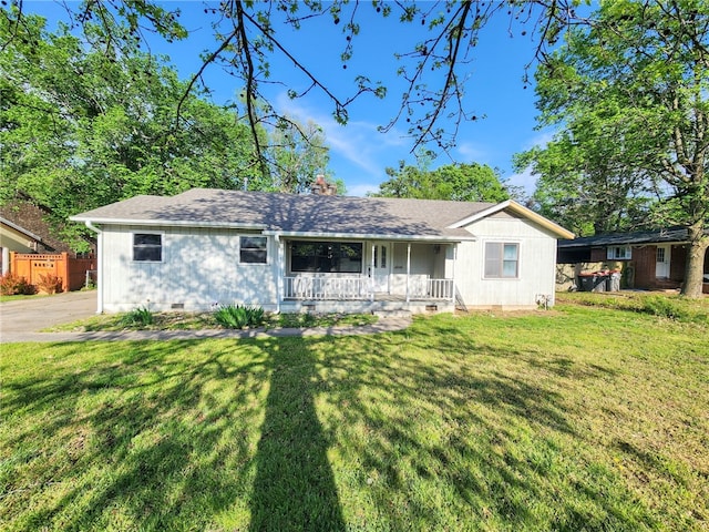 view of front of home featuring crawl space, a front lawn, covered porch, and a shingled roof