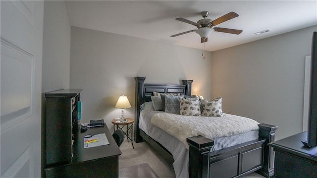 bedroom featuring ceiling fan and light colored carpet